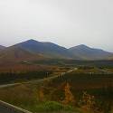View of mountain range and winding road in the fall.
